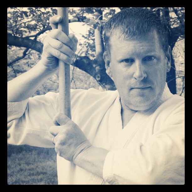 The author, holding a bokken (wooden sword).